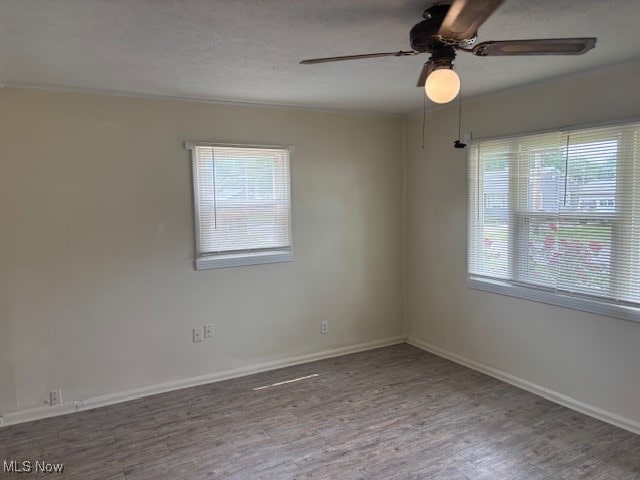 107 Mcdonald, Niles, OH 44446 - unfurnished room featuring ceiling fan, ornamental molding, wood finished floors, baseboards, and a textured ceiling