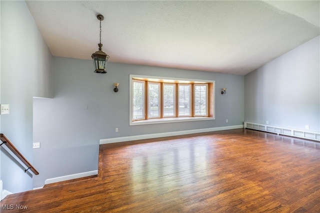 5046 Devon Dr, North Olmsted, OH 44070 - unfurnished living room featuring wood finished floors and baseboards