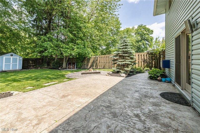 5046 Devon Dr, North Olmsted, OH 44070 - view of patio featuring a fire pit