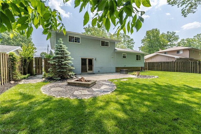 5046 Devon Dr, North Olmsted, OH 44070 - back of house with an outdoor fire pit and a patio area