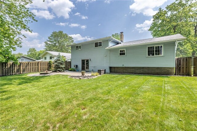 5046 Devon Dr, North Olmsted, OH 44070 - back of house with a chimney and a patio area