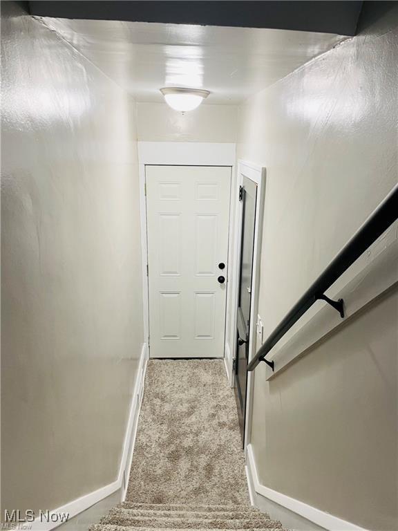 2511 4th St NW, Canton, OH 44708 - staircase featuring carpet floors and baseboards