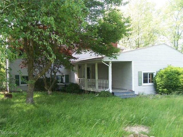 1475 Laurel Dr, West Salem, OH 44287 - back of house with a porch and a chimney