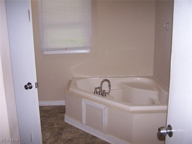 1475 Laurel Dr, West Salem, OH 44287 - bathroom with a bath and baseboards