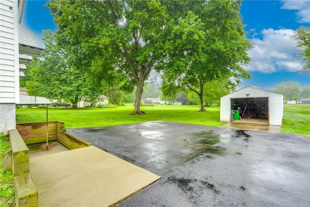 3985 Etter Rd, Mogadore, OH 44260 - view of patio / terrace with an outdoor structure and a garage