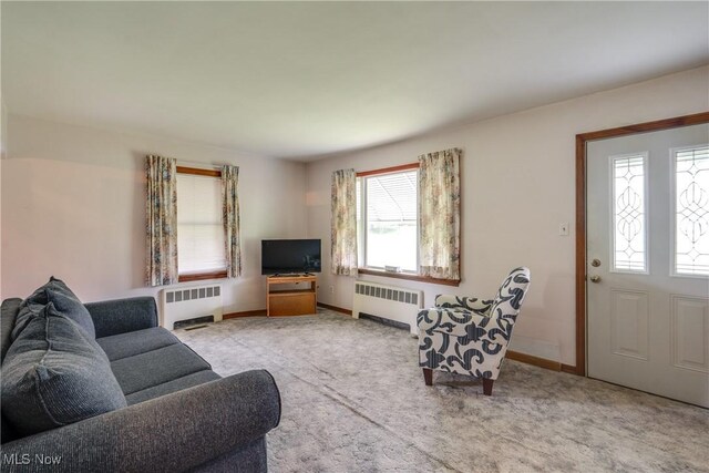 3985 Etter Rd, Mogadore, OH 44260 - living area with radiator, carpet floors, and baseboards