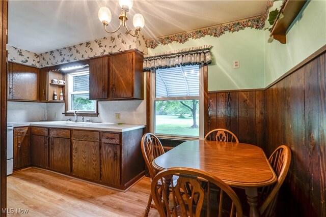 3985 Etter Rd, Mogadore, OH 44260 - kitchen with light wood-style floors, light countertops, a sink, a chandelier, and open shelves
