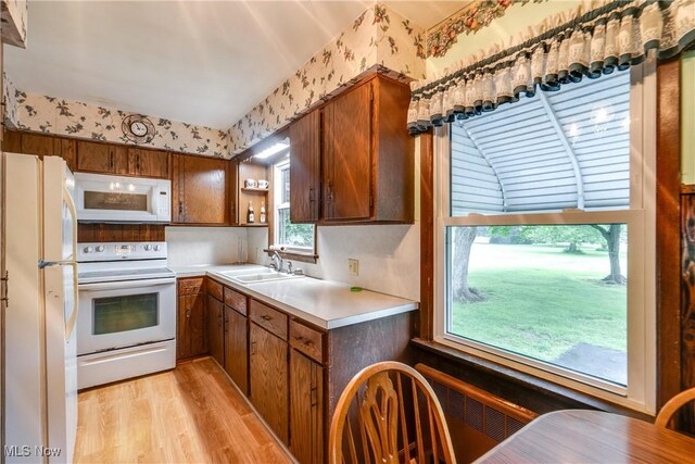 3985 Etter Rd, Mogadore, OH 44260 - kitchen featuring white appliances, a sink, wallpapered walls, light wood finished floors, and open shelves
