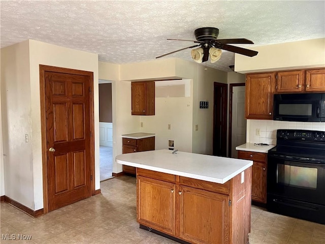 1023 55th St NE, Canton, OH 44721 - kitchen with black appliances, light countertops, brown cabinetry, ceiling fan, and baseboards