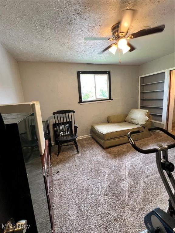 3524 E 139th St, Cleveland, OH 44120 - living room with ceiling fan, carpet floors, and a textured ceiling