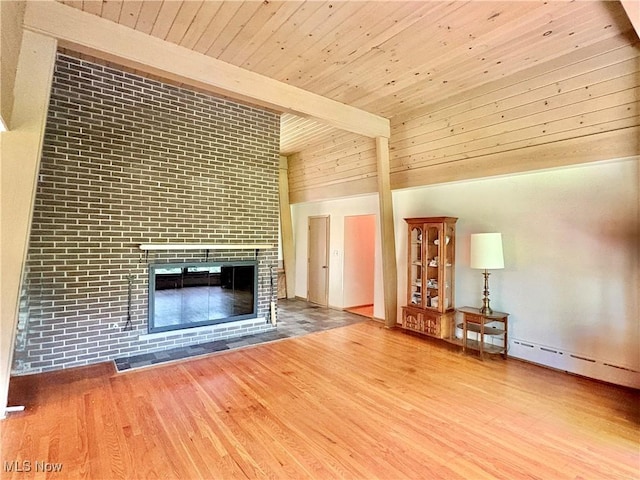 15959 Ridge Rd, North Royalton, OH 44133 - unfurnished living room with wooden ceiling, wood finished floors, a fireplace, and a baseboard heating unit