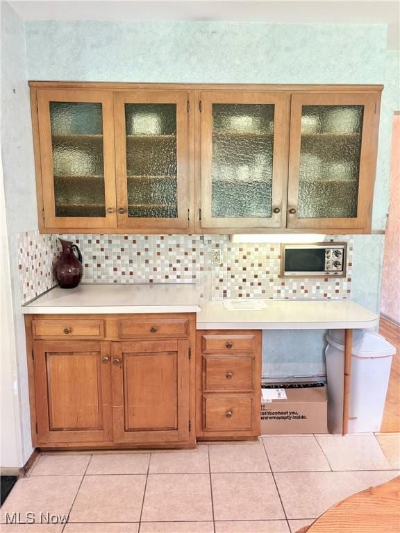 15959 Ridge Rd, North Royalton, OH 44133 - bar featuring backsplash and light tile patterned floors