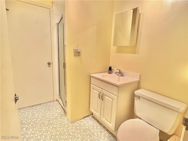 15959 Ridge Rd, North Royalton, OH 44133 - full bath featuring toilet, vanity, a shower stall, and tile patterned floors