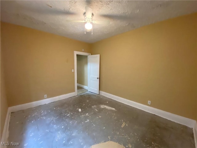 3454 E 118th St, Cleveland, OH 44120 - unfurnished room featuring baseboards, ceiling fan, and a textured ceiling