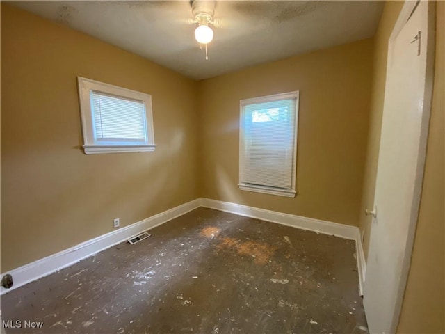 3454 E 118th St, Cleveland, OH 44120 - unfurnished room featuring baseboards and a ceiling fan