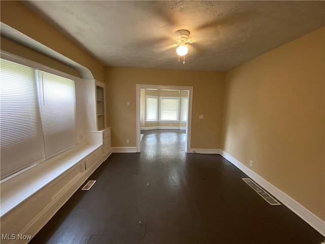 3454 E 118th St, Cleveland, OH 44120 - interior space with baseboards, ceiling fan, and dark wood-style floors