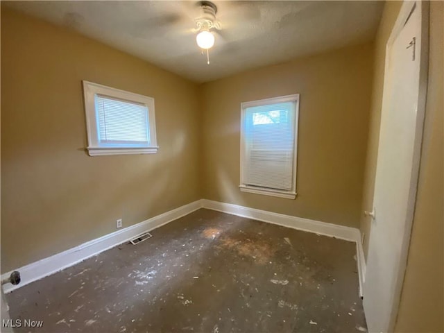 3454 E 118th St, Cleveland, OH 44120 - empty room with baseboards and concrete flooring
