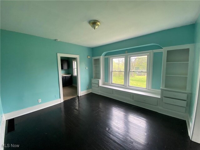 3454 E 118th St, Cleveland, OH 44120 - unfurnished room with dark wood-style flooring and baseboards
