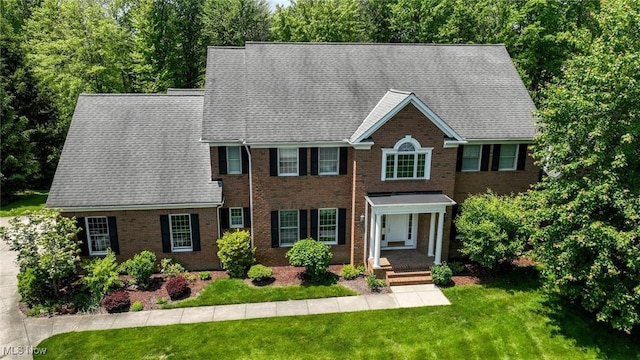 304 Fox Way, Chagrin Falls, OH 44022 - view of front of property with a front lawn and brick siding