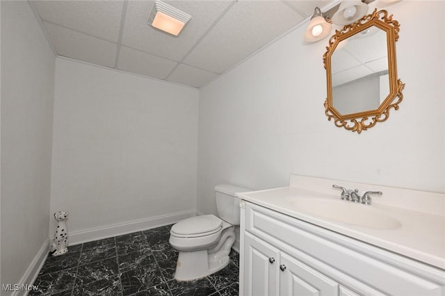 304 Fox Way, Chagrin Falls, OH 44022 - half bath featuring toilet, a paneled ceiling, vanity, and baseboards