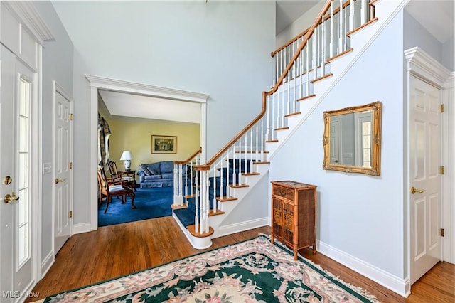 304 Fox Way, Chagrin Falls, OH 44022 - entrance foyer with wood finished floors, stairway, and baseboards