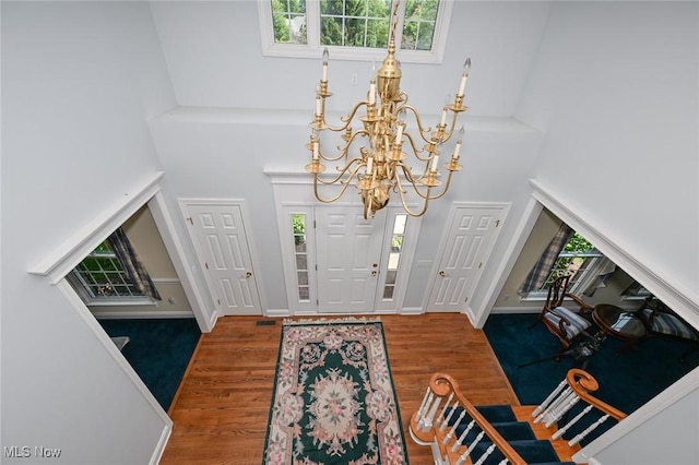 304 Fox Way, Chagrin Falls, OH 44022 - entryway with a chandelier, a high ceiling, and wood finished floors