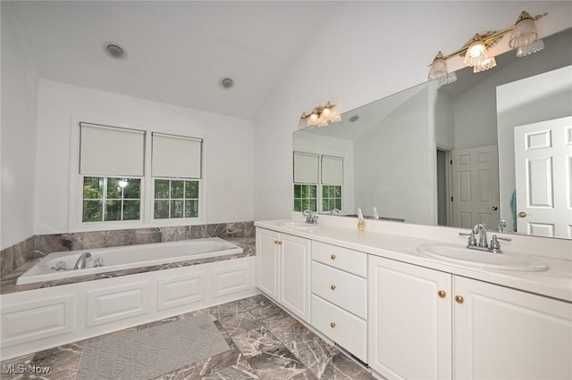 304 Fox Way, Chagrin Falls, OH 44022 - bathroom with plenty of natural light, double vanity, a bath, marble finish flooring, and high vaulted ceiling