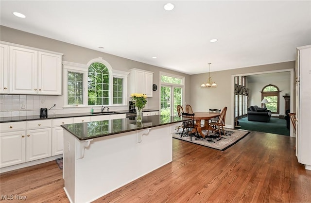 304 Fox Way, Chagrin Falls, OH 44022 - kitchen with a sink, white cabinets, a chandelier, a center island, and recessed lighting