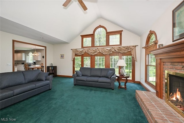 304 Fox Way, Chagrin Falls, OH 44022 - living room featuring a fireplace, high vaulted ceiling, a ceiling fan, dark carpet, and a chandelier