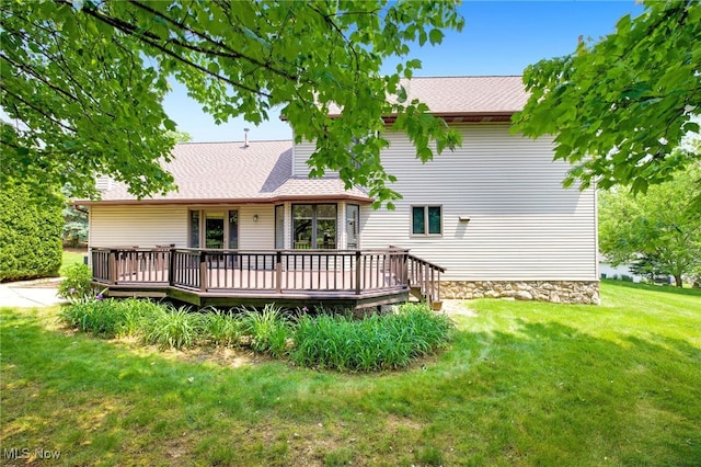 1908 Players Cir, Uniontown, OH 44685 - back of property featuring a wooden deck, a lawn, and a shingled roof