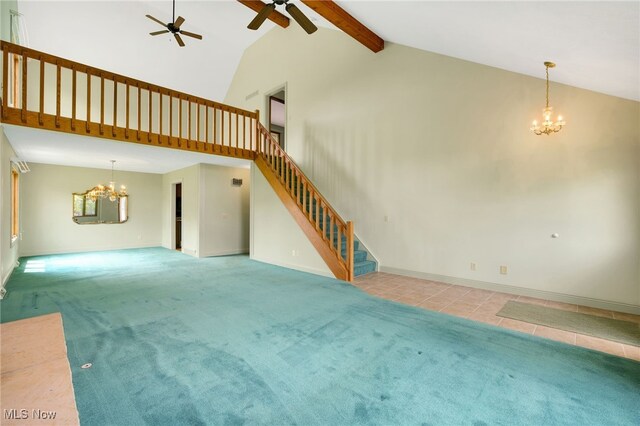 1908 Players Cir, Uniontown, OH 44685 - unfurnished living room with a chandelier, a ceiling fan, stairs, high vaulted ceiling, and carpet floors