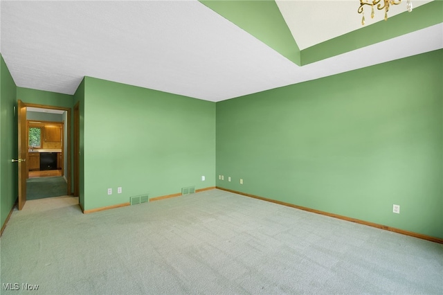 1908 Players Cir, Uniontown, OH 44685 - carpeted spare room featuring baseboards and a chandelier