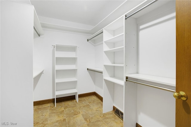 1908 Players Cir, Uniontown, OH 44685 - spacious closet featuring stone finish flooring