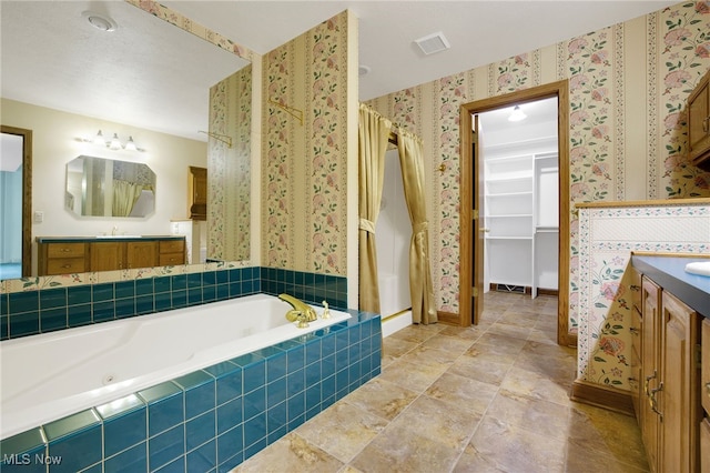 1908 Players Cir, Uniontown, OH 44685 - full bath with wallpapered walls, a garden tub, vanity, baseboards, and a shower with curtain