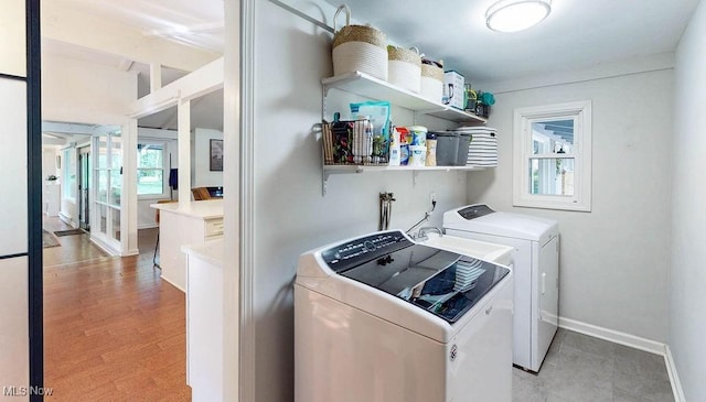 932 Bell Rd, Chagrin Falls, OH 44022 - laundry room with washing machine and clothes dryer, baseboards, and french doors