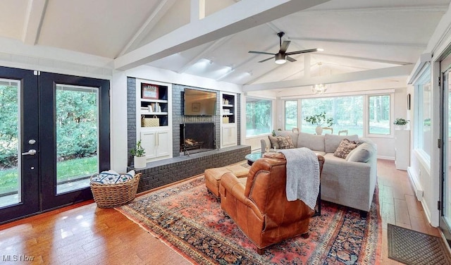 932 Bell Rd, Chagrin Falls, OH 44022 - living area with french doors, hardwood / wood-style floors, a fireplace, ceiling fan, and built in features