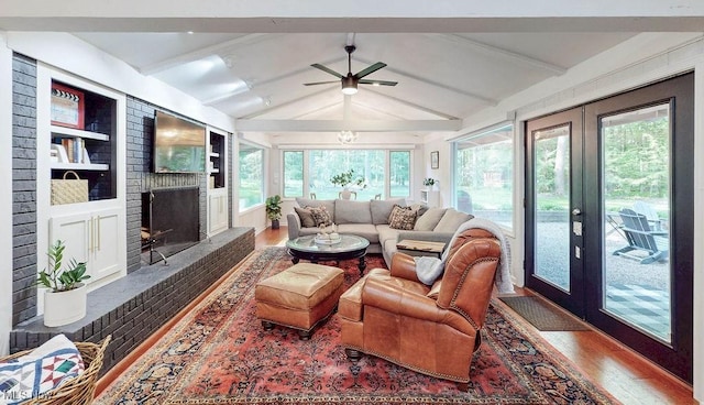 932 Bell Rd, Chagrin Falls, OH 44022 - living area featuring wood finished floors, french doors, a fireplace, and a ceiling fan