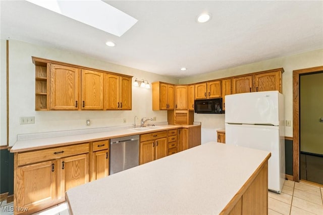 43628 Crestview Rd, Columbiana, OH 44408 - kitchen featuring stainless steel dishwasher, black microwave, freestanding refrigerator, a skylight, and a sink
