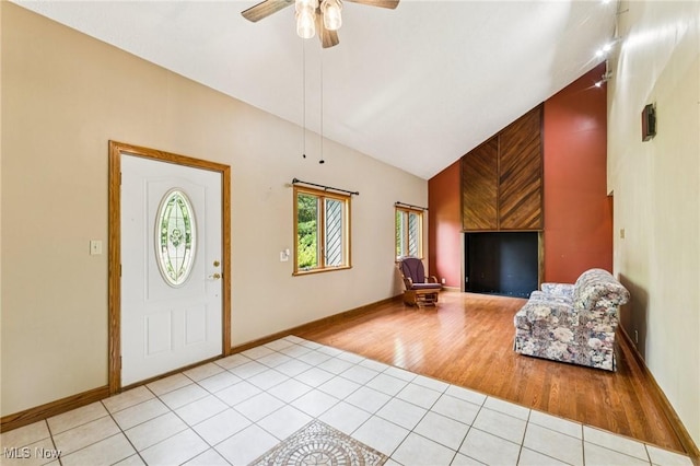 43628 Crestview Rd, Columbiana, OH 44408 - foyer entrance with light tile patterned flooring, lofted ceiling, ceiling fan, and baseboards