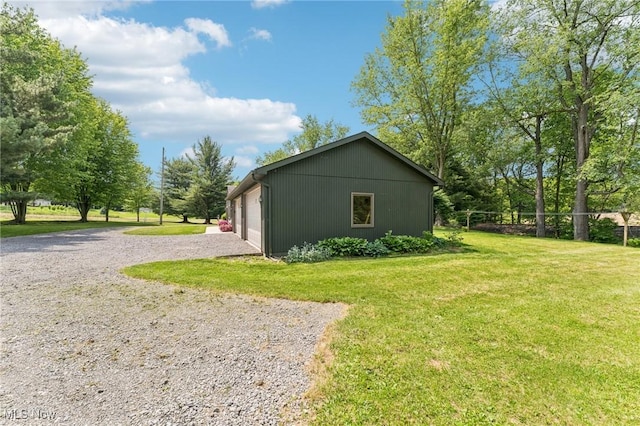 43628 Crestview Rd, Columbiana, OH 44408 - view of side of home featuring a yard and a detached garage
