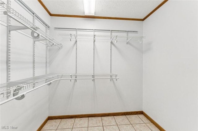 43628 Crestview Rd, Columbiana, OH 44408 - walk in closet featuring light tile patterned floors