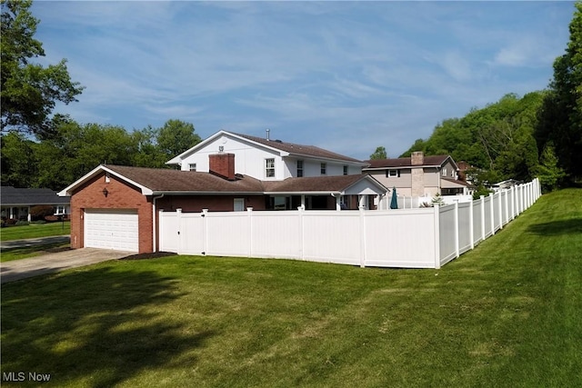 327 Country Club Blvd, Weirton, WV 26062 - rear view of property featuring driveway, a garage, and brick siding