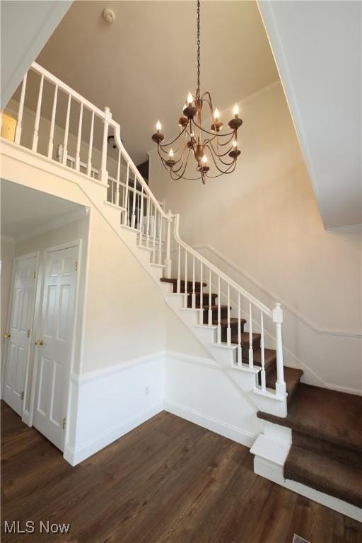 327 Country Club Blvd, Weirton, WV 26062 - staircase with wood finished floors, ornamental molding, a chandelier, baseboards, and a towering ceiling