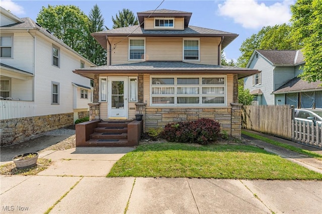86 24th St NW, Barberton, OH 44203 - american foursquare style home featuring stone siding and a shingled roof