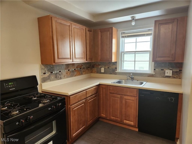 1039 Argonne Rd, South Euclid, OH 44121 - kitchen featuring black appliances, a sink, light countertops, decorative backsplash, and dark tile patterned floors