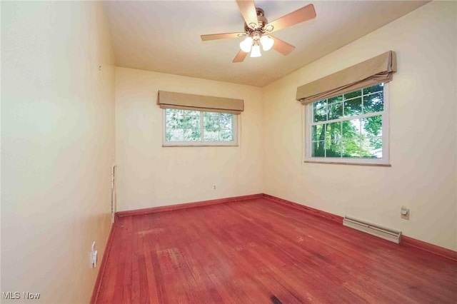 18373 Bentwood Dr, Doylestown, OH 44230 - spare room with plenty of natural light, wood finished floors, a baseboard heating unit, and a ceiling fan