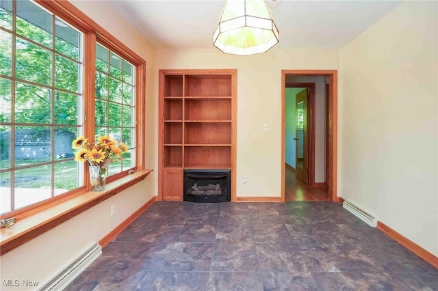 18373 Bentwood Dr, Doylestown, OH 44230 - unfurnished living room featuring plenty of natural light, baseboard heating, and baseboards