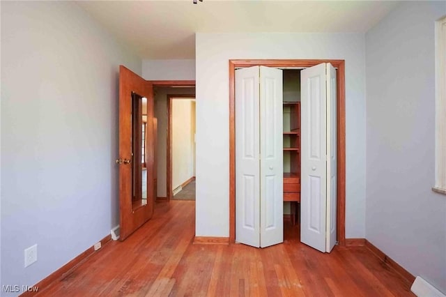 18373 Bentwood Dr, Doylestown, OH 44230 - unfurnished bedroom featuring light wood-style floors, baseboards, and a closet