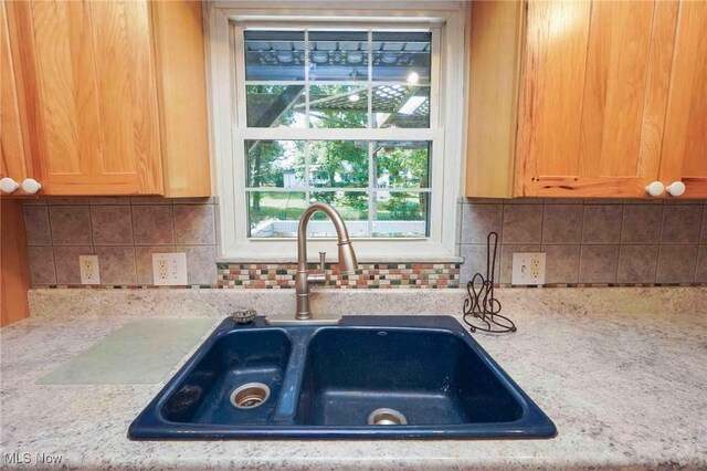 18373 Bentwood Dr, Doylestown, OH 44230 - kitchen with a sink and backsplash