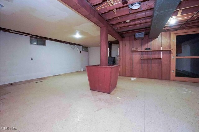 18373 Bentwood Dr, Doylestown, OH 44230 - finished basement with wood walls and tile patterned floors